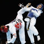 LONDRES. La taekwondista mexicana Jannet Alegría (rojo) durante su combate contra la jordana Raya Hatahet, correspondiente a la categoria de -49 kilos de la fase preliminar del torneo de taekwondo de los Juegos Olímpicos de Londres 2012. Foto: EFE