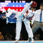 LONDRES. La taekwondista española Brigitte Yagüe (azul) combate contra la tailandesa Chanatip Sonkham, en semifinales del torneo de taekwondo de los Juegos Olímpicos de Londres 2012. Foto: EFE